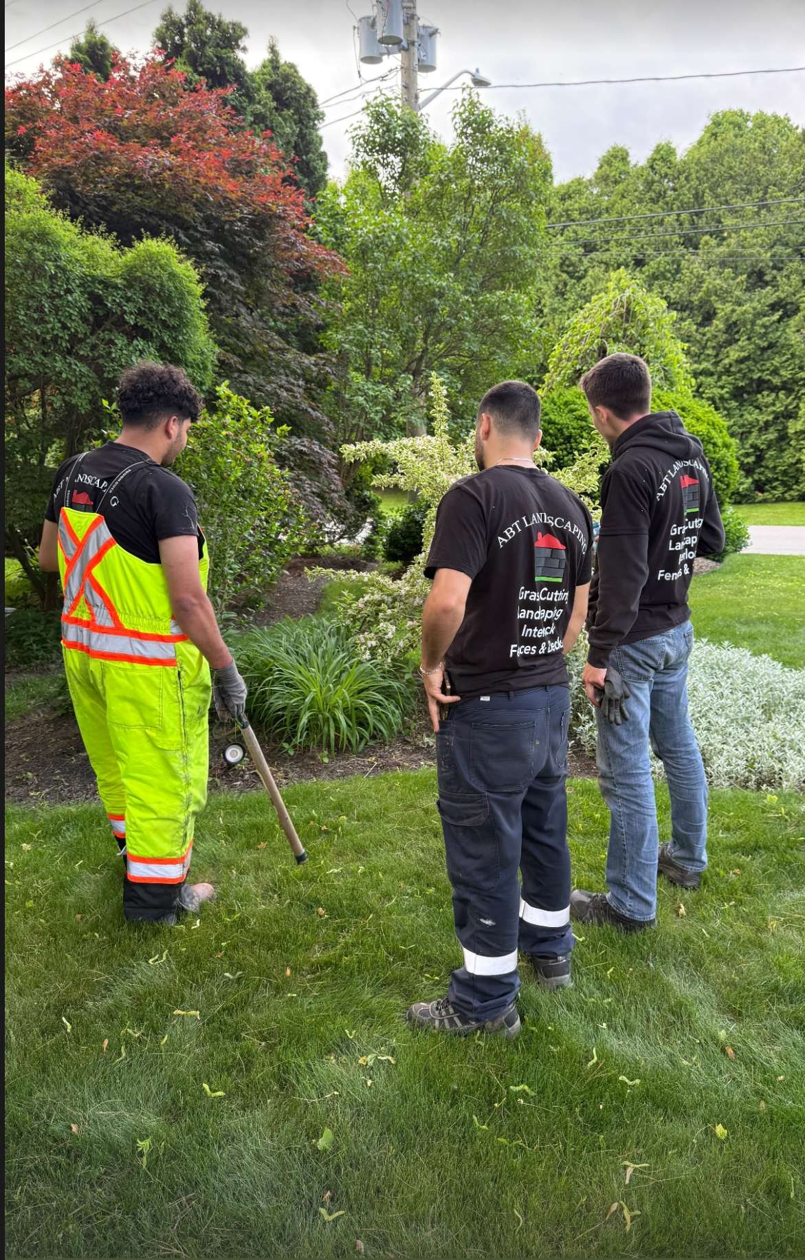ABT Landscape team reviewing work on a residential property